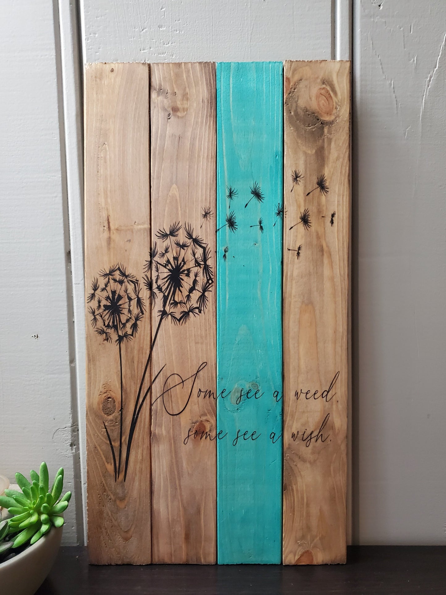 Some see a weed, some see a wish. Pallet sign