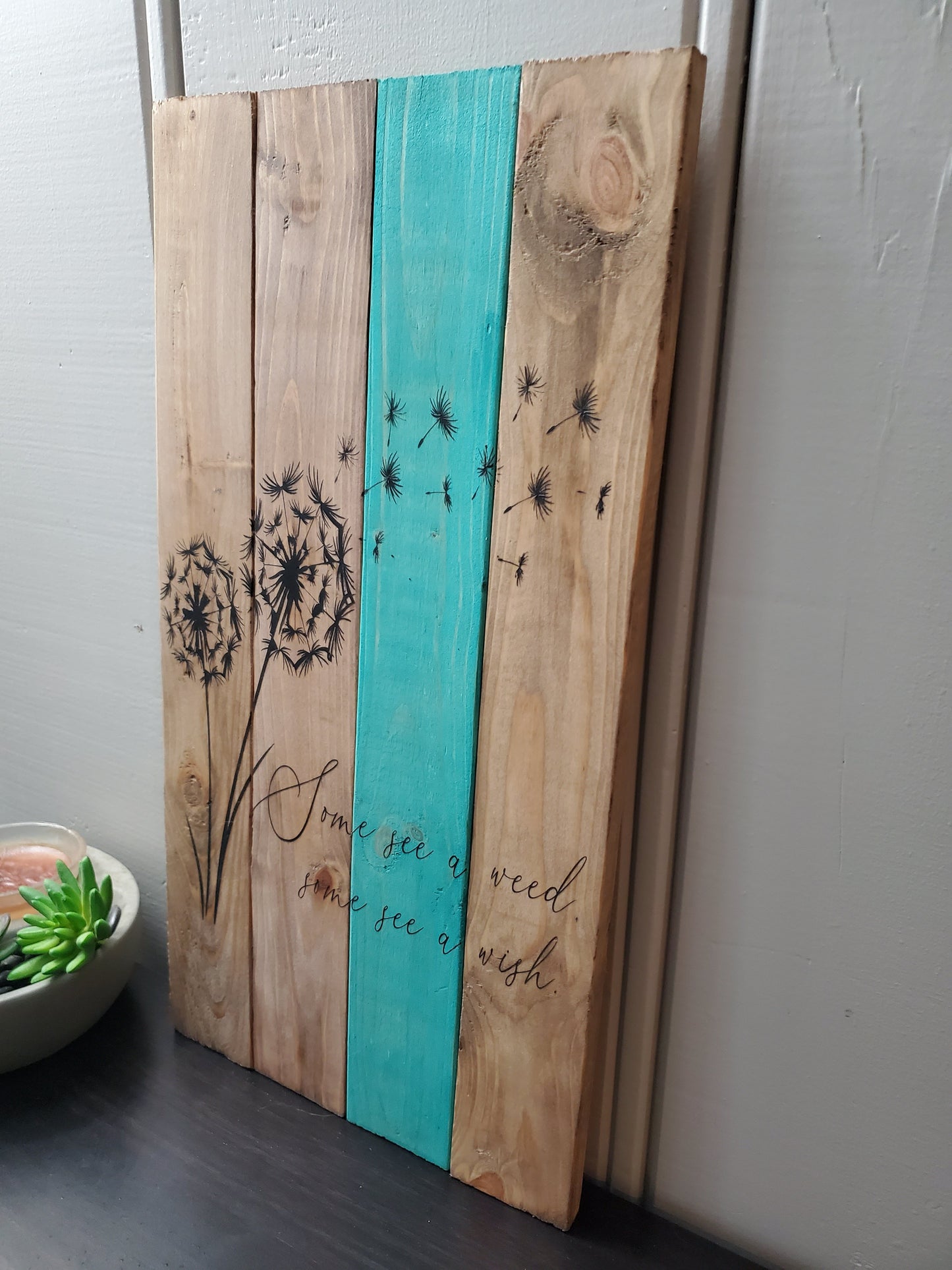 Some see a weed, some see a wish. Pallet sign
